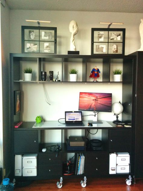 Materials: Expedit 5×5 Bookshelf, Expedit cabinets and drawers, Expedit Casters (4 sets), Frosted glass panel I saw this hack on a website previously about small space living and added a few touches of my own. Link here. Only changes I made were: 1. Added frosted glass topper 2. The shelf what was not built in [&hellip Standing Desk With Storage, Kallax Hack, Creative Desks, Desk With Storage, Comfortable Office Chair, Ikea Hackers, Furniture Classic, Bookshelves Diy, Desk Storage