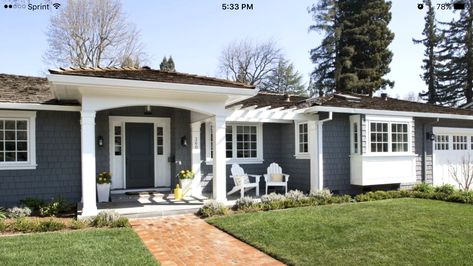 Patio could extend past walk way to bay windows.  Push plantar box forward toward the street to accommodate patio.  Add pergola over bay window.  Add another peak over the entryway off the garage.  Basically, flip the front of this house so pergola and patio are on the left. Painted Brick Ranch, Best Exterior Paint, Ranch House Exterior, Ranch Remodel, Gray House, Ranch Exterior, Brick Ranch, Home Exterior Makeover, Exterior Makeover