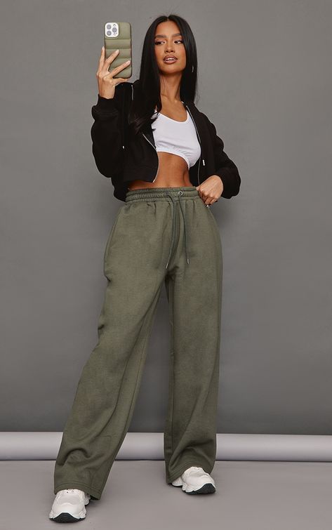 Hit refresh on your new season wardrobe with these petite moss khaki elasticated waist straight leg joggers, they're perfect for those off-duty days and beyond. Made using a moss khaki material with an elasticated waist and a straight leg fit, we're seriously obsessed. Team these joggers with a basic top, a cropped jacket and chunky trainers for a fresh finish.   Length approx 81cm/32 (Based on a sample size UK 6)   Model wears size UK 6/ EU 34/ AUS 6/ US 2   Model Height - 5ft 4 Khaki Sweatpants Outfit, Straight Leg Joggers Outfit, Uk College Outfits, Joggers And Crop Top, Straight Leg Sweatpants Outfit, Petite Womens Clothing, Straight Leg Joggers, Jogger Outfit, Legs Outfit