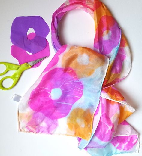 This silk scarf is dyed using tissue paper. You can create the shape out of the tissue paper and add it to the scarf. This is a great way to let the kids imagination go wild with creativity as they… Diy Silk Scarf, Homemade Gifts For Mom, Tissue Paper Art, Fabric Dyeing Techniques, Hand Dyed Silk Scarf, Tie Dye Crafts, Tie Dye Scarves, Painted Scarf, Diy Scarf