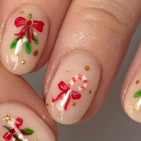 Clare @ Nail Hustle on Instagram: "POV: painting bows on everything for the foreseeable.  • • • • • • • • Bow nails bow trend trending nails christmas nails festive nail art handpainted nail art candy cane nails mistletoe  #bownails #bownailart #trendingnailart #tiktoknails #christmasnails #festivenails #christmasnailart #candycanenails #mistletoenails #decembernails #handpaintednailart #biabdolly #tgb #showscratch #shortnailinspo #biabapplication #nailitdaily #nailpro #nailartobsessed #christmasnailinspo #nailartinspo #trendingnails #shortnaildesigns" Ice Skating Nail Art, Simple Mistletoe Nails, Easy Christmas Tree Nail Art, Christmas Nails Vintage, Mistle Toe Nails, Mistletoe Nail Art, Nutcracker Nail Art, Christmas Nails Mistletoe, Vintage Christmas Nails