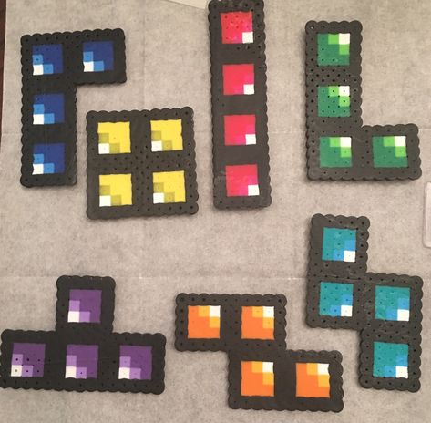 This Perler bead craft was inspired by the classic game Tetris.  As I was looking around for a new craft pattern for the kids, I saw this pin for sale on Etsy.  However, when I went there it was no… Beads Perler, Perler Designs, Easy Perler Bead Patterns, Pearl Beads Pattern, Fuse Bead Patterns, Hama Beads Design, Craft Beads, Perler Bead Templates, Diy Perler Bead Crafts