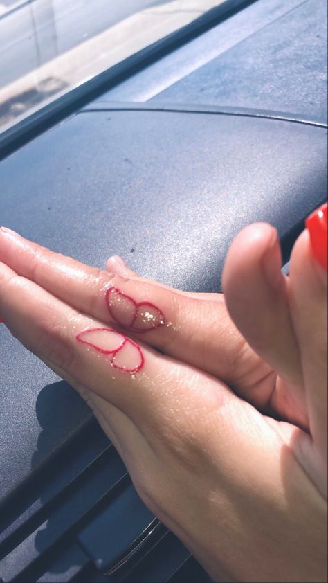 Matching red butterfly finger tattoo with my sister Cute Matching Finger Tattoos, Connecting Finger Tattoos, Matching Finger Tattoos Sisters, Sister Tattoos Finger, Friendship Tattoos Finger, Matching Sister Tattoos Funny, Matching Finger Tats, Small Tattoos Sisters, Finger Matching Tattoos