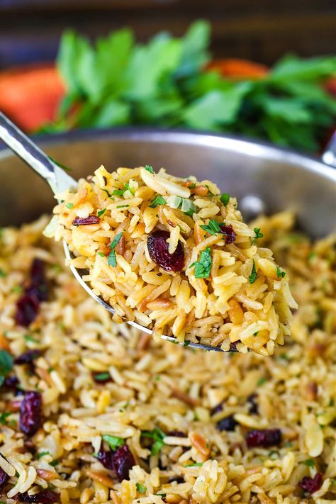 Rice Pilaf with Almonds and Cranberries is perfect for your holiday dinner! A make ahead side dish that goes with turkey, chicken or ham! Cranberry Rice, Make Ahead Thanksgiving, Christmas Side Dish, Easy Cocktail Recipes, Rice Pilaf Recipe, Cooking Onions, Pilaf Recipes, Christmas Side, Easy Roast Chicken