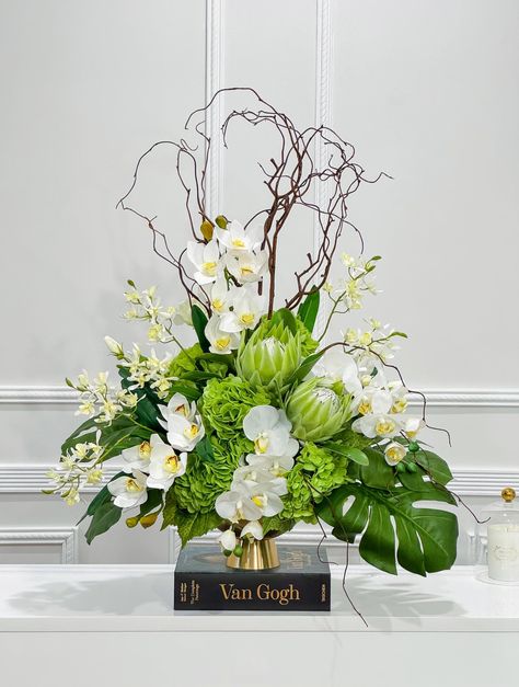 XX-Large Luxurious Real Touch Flower Arrangement - Elevate Your Space with Timeless Elegance Make a statement in your home or business with our Large Luxury High-End Real Touch Flower Arrangement This gorgeous arrangement feature mixed real touch  white orchids , green hydrangea, Lisianthus and Protea spray in gold vase.   Elevate your surroundings with the pinnacle of floral artistry - our Large Luxury Real Touch Flower Arrangement, meticulously designed and handmade to order by a 30-year-exper All Green Floral Arrangements, White Green Floral Arrangements, White And Green Flower Arrangements, White And Green Floral Arrangements, Green And White Tropical Floral Arrangements, Large White And Green Floral Arrangement, Hotel Flower Arrangements, Church Foyer, White Floral Arrangements