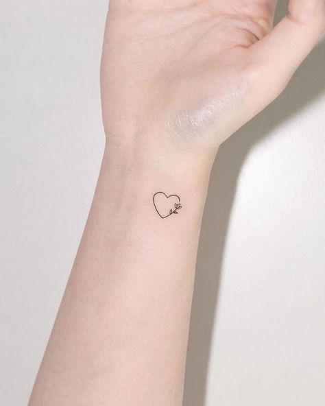 Subtle Love Tattoos, Light Gray Tattoos For Women, Subtle Heart Tattoo, Outlined Heart Tattoo, Heart With Writing Tattoo, Heart With A Tattoo, Modern Heart Tattoo, Heart Tattoo On Wrist Ideas, Simplistic Heart Tattoo