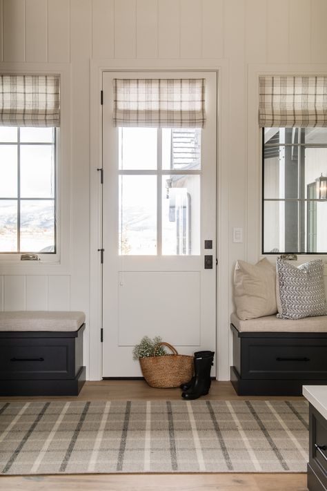 Mudroom Wall with vertical v-groove poplar painted White Drifts by Benjamin Moore. Built in cabinetry painted Off Black by Farrow and Ball. Custom Roman shades in plaid print by Schumacher. Designed by Remedy Design Firm. Built by Pure Haven Homes. Midway Utah, Fox Den, Stone Fireplace Surround, Custom Millwork, Modern Craftsman, Traditional Interior Design, Brick Flooring, Wall Trim, Traditional Farmhouse