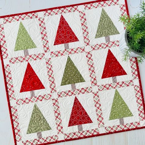 **NEW!!** Tree Mini!! This fun little tree mini will have your halls decked in no time!  Simple to make with traditional piecing.  No templates or special rulers.  I hope you love it! Finished size is 22” x 22”.  Kit includes the backing and can be purchased with or without our newest pattern, Mini Celebrations! It includes five seasonal minis. Paper and PDF patterns available. Tap link in profile to shop or visit our website SweetDaisyQuiltShoppe.com 📷Sweet Daisy Quilt Shoppe . . #... Little Trees Quilt Pattern, Christmas Tree Quilts, Christmas Quilts Ideas, Christmas Present Quilt, Quilts Christmas, Daisy Quilt, Tree Quilt Block, Tree Quilt Pattern, Suzy Quilts