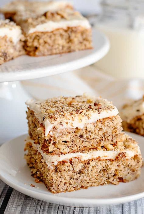 Banana Nut Bars - Whip up these easy moist Banana Bars with Cream Cheese Frosting! They have a dash of cinnamon for a warm spice and are sprinkled with nuts. This banana bar recipe is the perfect way to use up leftover bananas and is so quick to throw together. #dessertrecipes #cookiedoughandovenmitt Leftover Banana Recipes, Leftover Bananas, Nuts Cake, Banana Nut Cake, Banana Walnut Cake, Banana Cakes, Ripe Banana Recipe, Nut Cake, Nursing Cake