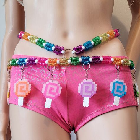 This kandi belt is made with glitter pony beads and candy perler charms. Includes one kandi belt. Harness & accessories sold separately. One size fits most. This item ties in the back & around neck for easy adjusting. This Item is premade and is ready to ship! Perfect for any event! You will get lots of compliments in this unique wearable art! Stand out at your next event! Edm festival  Raves Party  Rave outfit  Festival outfit Pride Mardi gras Rave gift  Rave birthday Glow party Lifestyle party Candy Rave Outfit, Kandi Clothes, Kandi Belt, Kandi Harness, Perler Charms, Rave Essentials, Diy Festival Outfit, Rave Harness, Rave Birthday