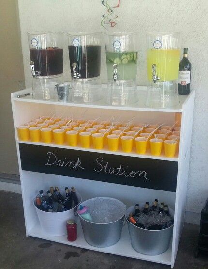 My friend Michael made this drink station for his son's first birthday party.  The chalk board idea gave it the perfect final touch. Party Cooler Drink Stations, Drink Display For Party Beverage Stations, Diy Party Bar Drink Stations, Birthday Bar Ideas Alcohol, Drink Stand For Party, Party Drinks Set Up, Drinking Station Ideas Party, Party Drink Container Ideas, Drink Bar Ideas Party