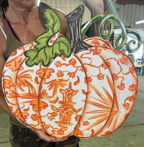 Thank you for your interest in our Painted Door Hangers! This hand painted door hanger features a Pumpkin in a Chinoiserie Orange Pattern with vines. Would make a great addition to your front door when decorating this Fall.  All door hangers are made out of weatherproof high quality 1/4'' MDF. This particular Fall Pumpkin door hanger is 21'' tall and 22'' from the widest points. Each wooden door hanger is painted with Acrylic paint and sealed with a clear protective coat.  This painted fall door Christmas Door Hangers Pumpkin, Pumpkin Door Hangers, Pumpkin Door Hanger Wooden, Round Thanksgiving Door Hanger, Thanksgiving Door Hangers, Three Pumpkin Door Hanger, Holiday Door Hangers Pumpkin, Painted Door Hangers, Thanksgiving Pumpkin Door Hangers