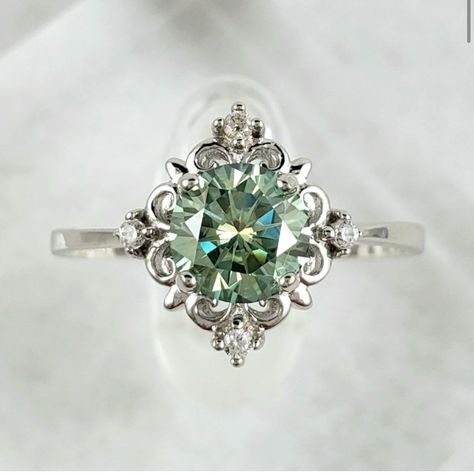 Stunning 6.5mm, 1ct Green Moissanite Victorian Style Solid Sterling Silver Ring, Stamped S925 Is Handmade & One Of A Kind. Features 1ct, 6.5mm D Color (Green) Excellent Round Cut Vvs1 Clarity Solid Sterling Silver Setting S925 Gra Certificate Included Checkout My Matching Earrings Available On My Page And Make It A Set, Sold Separately. Emerald Engagement Ring Vintage Unique, Mass Agate Engagement Ring, Pretty Silver Engagement Rings, Silver And Emerald Ring, Green And Silver Engagement Ring, Green Saphire Ring, Green Sapphire Engagement Ring Silver, Funky Engagement Rings Silver, Gemstone Engagement Rings Silver