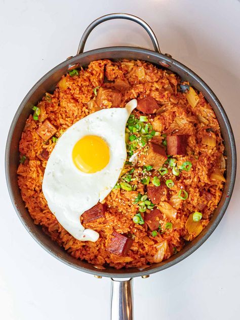 Kimchi fried rice with spam is a delicious way to use up leftover ripe kimchi and day old rice. Add fried spam and a fried egg to take this to another level! #kimchifriedrice #kimchi #koreanrecipes #drivemehungry | drivemehungry.com Fried Rice With Spam, Rice With Spam, Fried Spam, Kimchi Noodles, Easy Korean Recipes, Spam Recipes, Fermented Kimchi, South Korean Food, Kimchi Fried Rice