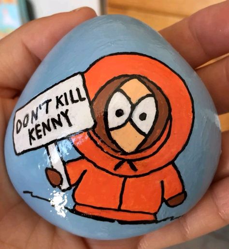 Painted Rocks. South Park character Kenny Kenny South Park Painting, Kenny South Park Drawings, Kenny South Park Drawing Easy, South Park Rock Painting, South Park Painted Rocks, South Park Painting Ideas, Stranger Things Painted Rocks, What To Paint On A Rock, Painted Rocks Characters