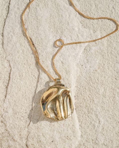 This stunning product shot has got to be one of my favorites from the Badlands Collection featuring the Panamint Pendant on a sleek leather cord. This pendant embodies the essence of the collection, as it was one of the first pieces I created for it back in early 2023. It set the tone for the entire collection, inspiring the texture and form of the other pieces. The leather cord strikes the perfect balance between modern and sophisticated, while still having a touch of playfulness and surpri... Wax Sculpture, Leg Bag, Wax Casting, Lost Wax Casting, Leather Chokers, Gold Choker, Lost Wax, Round Pendant, Gold Filled Chain