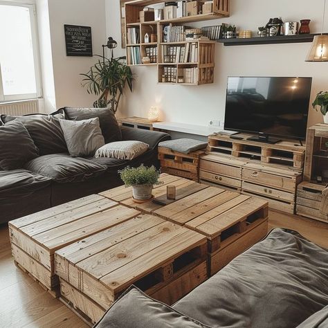 Cozy living room with oversized sectional sofa, repurposed wooden crate coffee table, and personalized shelves showcasing books and trinkets. Neutral tones and natural materials create a warm and inviting atmosphere. Wooden Crate Coffee Table, Oversized Sectional, Oversized Sectional Sofa, Oversized Coffee Table, Crate Coffee Table, Wooden Crate, Apartment Living Room, Cozy Living Rooms, Cozy Living