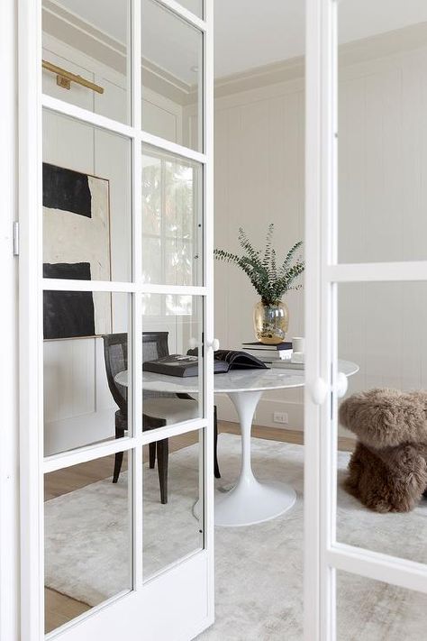 White french doors open to a beautifully appointed home office. White French Doors Office, Office Doors For Home, Home Office French Doors, French Door Office, Den Doors, Home Office With French Doors, French Doors Office, Office French Doors, French Doors Inside