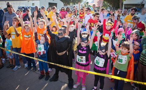 Kids do stretches as they line up to participate in a "fun run" during the Santa Clara County Sheriff's Office "Hero's Run," near the Sheriff's office in San Jose Saturday, Nov. 9, 2013. There was a 5K fun run/walk for adults and kids. And the kids were encouraged to participate dressed up as their favorite super hero. After the running events ended, there was a costume contest for the kids as well as a police dog demonstration. (Patrick Tehan/Bay Area News Group) School Fundraising, Running Events, Police Dog, Running 5k, Fundraising Ideas, Raising Money, Monster Mash, Kids Area, Kids Running