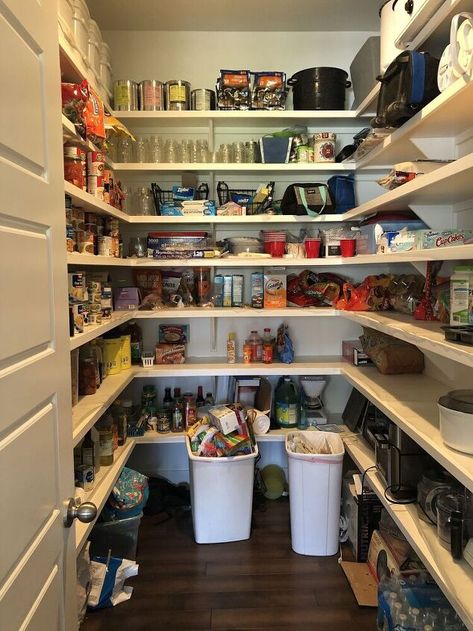 I have loved my big pantry but was always embarrassed when someone asked where my garbage was and they would walk into my unorganized-wreck of a pantry. Check out my before and after of my pantry makeover! I invite everyone inside now! Here is my before...When we built, we extended our pantry so have more shelving and had them add two more shelves above what they had installed because there was about a 5' gap between the top shelf they put in and the ceiling. We had our trash can… Party Pantry, Big Pantry, Diy Wall Sconces, Hidden Tv Cabinet, Fairy Lights In Trees, Beadboard Paneling, Large Glass Jars, Pantry Remodel, Pantry Makeover