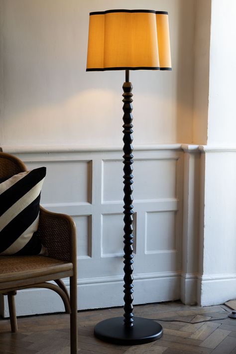 The Black Spindle Floor Lamp With Scalloped Shade combines classic design and trend-led style. A beautiful addition to your living room, hallway or bedroom, the black wooden floor lamp base is designed in homage to bobbin furniture, with the update of asymmetric hexagon shapes in contrast to the bobbin trend’s signature round design. Perfect for modern floor lamp lovers and those with an eye for vintage-inspired style, the black floor lamp features a gorgeous, scalloped lampshade in a natural hu Black Floor Lamp Living Room, Black Wooden Floor, Lamps Unique, Vintage Floor Lamps, Stained Glass Lighting, Wooden Floor Lamp, Antique Floor Lamps, Wooden Floor Lamps, Modern Floor Lamp