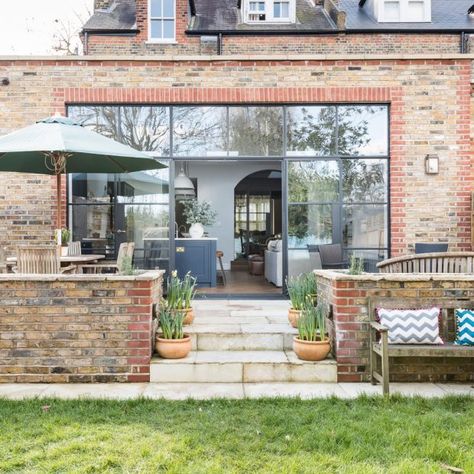 Modern garden with conservatory extension with glass windows Conservatory Extension, Exterior Doors With Glass, Room Extensions, Glass Extension, Sloped Garden, Edwardian House, House Extension Design, House Extensions, Living Room Diy