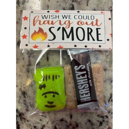 Prepare for a spooktacular Halloween with our Spooky S'mores Halloween Treat Bags, the perfect treat for goblins, ghosts, and ghouls of all ages! These adorable bags are filled with all the essential S'mores ingredients you need for a sweet and hauntingly delicious experience. What's Inside: - Mini Hershey's Milk Chocolate Bar: Rich and creamy, it's the perfect chocolatey foundation for your S'mores creation. - Peeps Marshmallow Ghost, Pumpkin, Monster and Sugar Skull: These ghostly marshmallows Smores Baggies, Smores Bags Favors, Halloween Smores Treat Bags, Halloween Treat For Coworkers, Adult Halloween Goodie Bags, Smores Treat Bags, Halloween School Treats Bags, Halloween Gift Bag Ideas, Birthday Bonfire