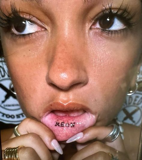 Meow Lip Tattoo, Underlip Tattoos, Inner Lip Tattoo Words, Inner Lip Tattoo Ideas, Lip Tats, Mew Tattoo, Inside Lip Tattoos, Lip Tattoo Ideas, Meow Tattoo