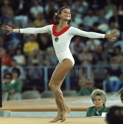 Olga Korbut of USSR. She was 17 years old when she competed in the 1972 Munich Olympics, performing her extraordinary "Korbut flip" Olga Korbut, 1972 Olympics, Gymnastics Routines, Nadia Comaneci, Gymnastics Hair, Amazing Gymnastics, Summer Olympic Games, Gymnastics Pictures, Olympic Gymnastics