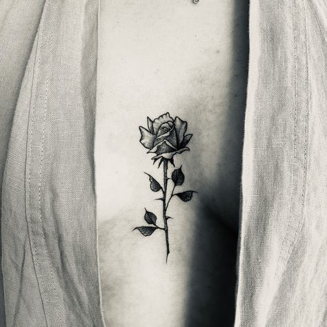 Rose Sternum Tattoo, Rose Between Breast Tattoo, Rose Tattoos For Women, Sternum Tattoo, Skeleton Hand Tattoo, Skeleton Hands, Body Piercings, Feminine Tattoos, Tattoo Placement