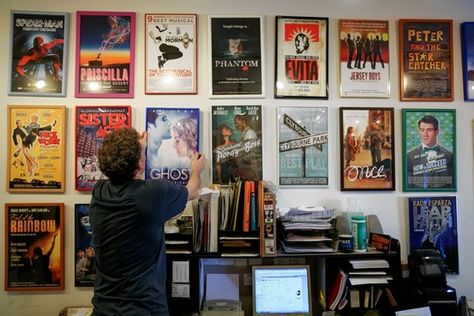 Nick Hoogstraten hangs a framed poster for the production of 'Ghost' at Triton Gallery. Gallery Wall Band Posters, Band Poster Wall Room Ideas, Movie Poster Wall Decor Ideas, Framed Posters On Wall Bedroom Aesthetic, Movie Posters Bedroom, Movie Poster Gallery Wall, Music Basement, Band Posters On Wall Bedroom, Deco Cinema