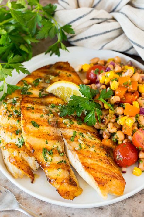 This grilled tilapia is fish fillets coated in a zesty marinade, then cooked on the grill to tender perfection. A quick and easy recipe that always gets rave reviews from family and friends, and pairs well with a variety of side dishes. Grilled Talapia Ideas, Grilled Tilapia Recipes, Fried Tilapia Recipes, Frozen Tilapia, Fried Tilapia, Grilled Tilapia, Grilled Broccoli, Seared Ahi, Fish Fillets