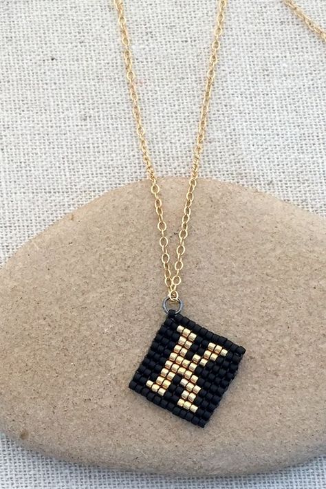 Initial charm made out of beads using square stitch Square Stitch Beading Patterns, Square Stitch Beading, Stitch Jewelry, Square Stitch, Bead Loom Bracelets, Diy Coasters, Bead Loom Patterns, Beaded Bracelet Patterns, Beaded Jewelry Patterns