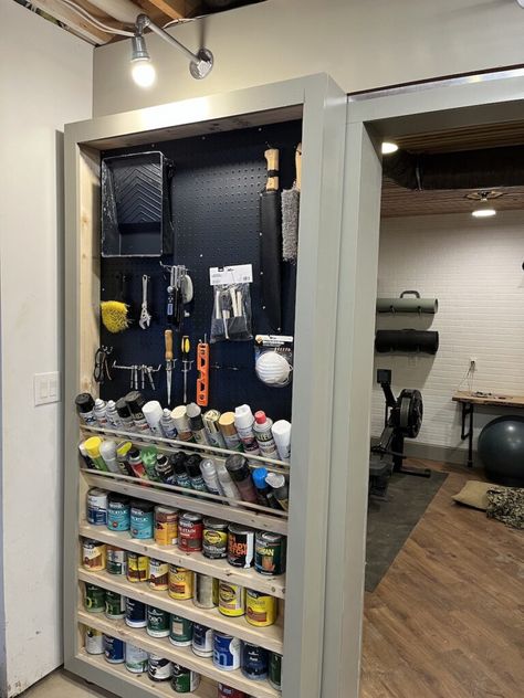 I added a rolling shelf with a track that acts like a hidden door in my basement workshop. It closes off the other room and provides more storage.