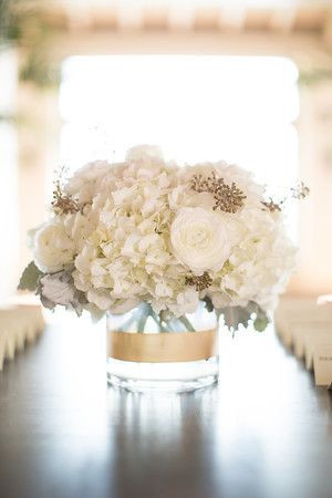 Jenny and Daniel were married at lovely Bel Air Bay Club in Pacific Palisades. I really enjoyed working with these two — they are a fun and cute couple! The following beautiful images are from Christine Chang photography. Jenny carried a natural design hand tied bouquet with mostly white flowers accented with dusty green and gold. Flowers included: peonies, rose, ranunculus, freesia, tulips. Gold Centerpieces, White Wedding Bouquets, Pacific Palisades, Trendy Flowers, 50th Wedding Anniversary, Wedding Table Decorations, 50th Wedding, White Bouquet, Wedding Cake Designs