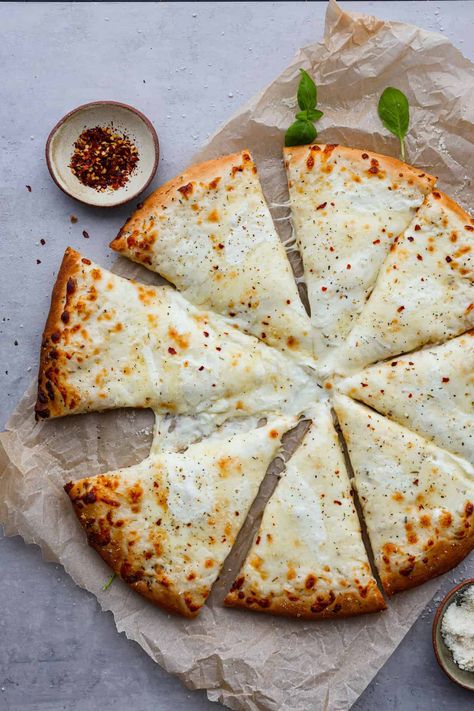 White Pizza, also called pizza bianca, is a delicious and soft and chewy pizza crust topped with a creamy Parmesan sauce and mozzarella cheese. There's every reason to fall in love with this recipe. It's quick and easy and a total hit! White Pizza Recipe, Freeze Pizza Dough, White Pizza Sauce, White Pizza Recipes, Pizza Dough Recipe Easy, White Sauce Recipes, Creamy Parmesan Sauce, Pizza Bianca, White Pizza