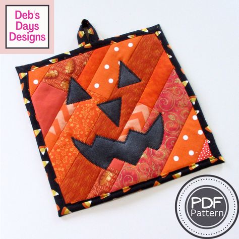 Learn how to make a quilted Jack O' Lantern potholder using cotton fabric scraps and strips with the quilt-as-you-go technique using this PDF sewing pattern. This hanging hot pad uses raw edge appliqué, a simple self binding, and includes easy directions on how to make mitered corners. It's a great project for quilting and sewing beginners to make their own handmade cloth potholder, hot pad, or trivet for the spooky Halloween holiday kitchen. Since it's a digital download pattern you can start t Holiday Potholders To Sew, Pumpkin Potholder Pattern, Quilted Potholders Patterns Free, Quilted Hot Pads Patterns Free, Halloween Potholder Patterns, Quilted Pumpkin Potholders, Halloween Pot Holders, Halloween Potholders, Orange Paper Craft