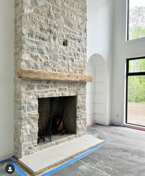 Cobblestone Fireplace Ideas, Limestone Hearth Fireplace, Stone Fireplace No Hearth, Wood Burning Fireplace With Tv Above, Stone Fireplace With White Mantle, Amber Interiors Fireplace, Simple Stone Fireplace, German Schmear Stone Fireplace, Overgrouted Stone Fireplace