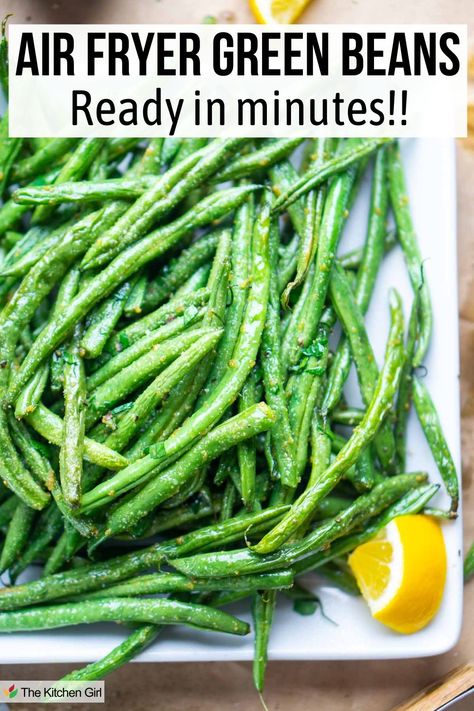 Cooked green beans on white plate with lemon wedge. Title: Air Fryer Green Beans: Ready in minutes!! Cooking Frozen Green Beans, Air Fryer Green Beans, Air Fried Green Beans, Delicious Green Beans, Crispy Green Beans, Fried Green Beans, Frozen Green Beans, Side Dish Recipes Easy, Air Fryer Dinner Recipes