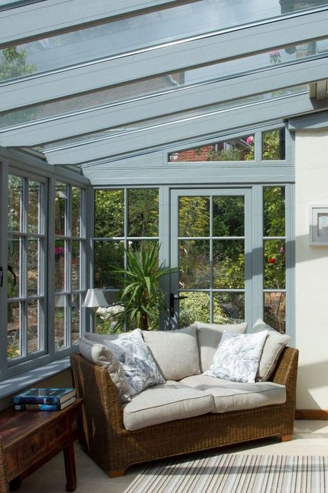 Inside this timber conservatory is a light and airy room, with our temperature control New Generation Glass installed throughout, to keep the temperature comfortable whatever the weather. The customer chose to include a timber glass panelled door between the conservatory and the property to match the style of the conservatory, which still allows light through while closing the conservatory off from the main home when required. Timber Conservatory, Conservatory Ideas Interior, Cottage Conservatory, Small Conservatory Ideas, Orangery Kitchen, Dark House Exterior, Flint House, Conservatory Interiors, Conservatory Home