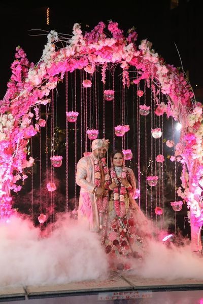 Photo By Blush Decor - Decor Jaimala Stage Decoration Indian, Jaimala Stage Decoration, Varmala Stage Decor Indoor, Pink Wedding Garland Indian, Jaimala Stage, Bridal Entry For Varmala, Pink Mandap Decor, Indian Wedding Decorations Receptions, Engagement Stage Decoration