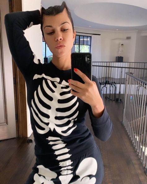 KOURTNEY Kardashian has gone all out for Halloween, showing fans some of her spooky decor at her Calabasas mansion. Posting photos to Instagram, the 42-year-old posed in a skeleton costume as she showed off her skulls, pumpkins and candles all around her home. The Poosh founder captioned the photos: ‘‘Tis the season!’ On the outside […] Kourtney Kardashian Instagram, Kardashian Kylie Jenner, Rachel Lindsay, Kylie Jenner Photos, Kylie Jenner Instagram, Skeleton Costume, Travis Barker, Universal Studios Hollywood, Themed Cupcakes