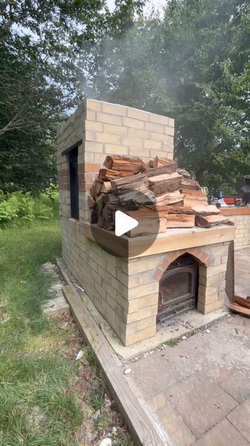 Kristin & Hank | Homesteading in PA on Instagram: "How we transformed our homestead with a DIY smoker! It all started when we stumbled upon a free wood stove, sparking the idea to integrate it into our outdoor kitchen setup. With a clear vision in mind, we strategically positioned the stove within our brick structure and began the meticulous process of fabrication.   The first challenge was to create a custom chimney that would efficiently channel smoke from the stove to the smoker box. Thanks to the skilled hands of our friends Andy, Nate, and Seth, who brought their professional welding expertise and tools, we were able to design and weld a durable chimney that seamlessly connected the stove to our newly constructed smoker box.  We surrounded the smoker with a layer of sturdy brick, ensu Diy Brick Bbq Grill And Smoker, Bbq Smokers Build, Diy Outdoor Stove, Smoker Diy, Outdoor Kitchen Setup, Brick Smoker, Outdoor Wood Stove, Homesteading Garden, Backyard Smokers