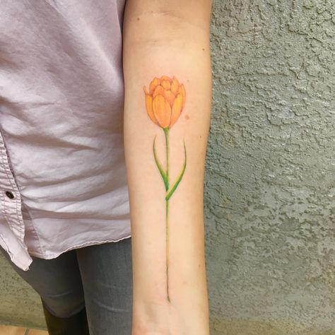 Yellow tulip tattoo Yellow Tulip Tattoo, Tulip Tattoo Meaning, Tulips Tattoo, Tulips Meaning, Arm Wrap Tattoo, Yellow Tattoo, Tulip Tattoo, Flower Tattoo Meanings, Wrap Tattoo