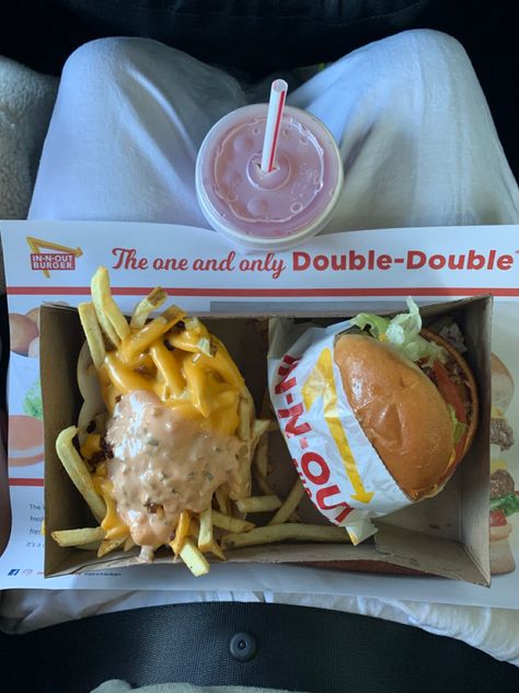 In-n-out burger and fries animal style with a pink lemonade to go. Aerial view of meal on lap In In Out, Usa Fast Food, In And Out Aesthetic, In And Out Burger Aesthetic, In And Out, In N Out Aesthetic, In Out Burger, Fast Food Lunch, Fast Food Orders