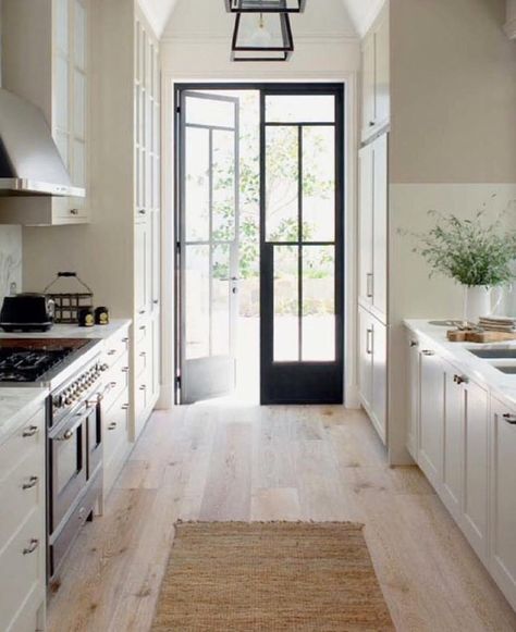 Pretty galley kitchen via @thegreyinteriors! Also splurge + save floor lamp picks up on the blog today! Have a great night. Kitchen Patio Doors, Black French Doors, Narrow Kitchen, Apartment Decoration, French Doors Patio, New England Homes, Kitchen Concepts, Galley Kitchen, Patio Doors