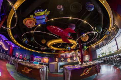 Pizza Planet Aesthetic, Alien Stage Cafe, Scifi Restaurant, Retro Futurism Restaurant, Pizza Planet Sign, Alien Pizza Planet, Sci Fi Diner Hollywood Studios, Disneyland Restaurants, Restaurant Aesthetic