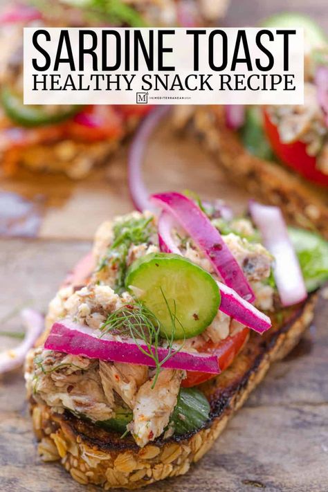 Sardine toast with pickled red onions, dill, chermoula, cucumber and tomato. An easy and affordable healthy snack recipe! Sardine Recipes Canned, Sardine Toast, Osteoporosis Diet, Healthy Snack Recipe, Cucumber And Tomato, Sardine Recipes, The Mediterranean Dish, Mediterranean Kitchen, Toast Toppings