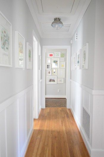 Benjamin Moore Moonshine is a bright panit colour for a dark hallway. Looks good with board and batten, wainscoting and wood flooring by Young House Love Decorating A Narrow Hallway, Hallway Paint, Dark Hallway, Young House, Upstairs Hallway, Young House Love, Narrow Hallway, Hallway Decorating, Grey Walls