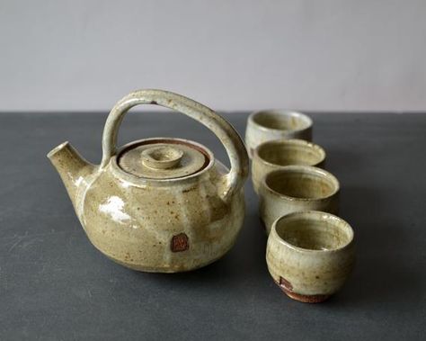 In Ferment Symbiosis of art, health, and food in timeless fermenting ceramic vessels.Enjoy and have fun with a fantastic Teapot coming straight for the forest of the Northwest- true! We made the glaze from the forest-trees ash!Teapot glazed with a unique ash glaze, which we named Moss because of its stunning combination of greens grays and GOLD colors. Its appearance varied each time it comes out from the long high -temperature firing in the kiln. It looks like a merge of minerals and organic le Ceramic Tea Cup Set, Tea Pots Ceramic, Tea Pot Pottery, Modern Tea Set, Pottery Tea Cups, Tea Pot Ceramic, Ceramic Teapot Set, Pottery Tea Pots, Health And Food